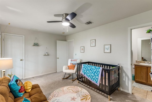 18701 Golden Eagle Way, Elgin, TX 78621 - bedroom with light carpet and a ceiling fan
