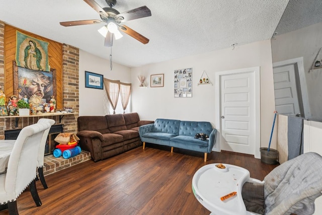 11303 Nicole Cv, Austin, TX 78753 - living area featuring a ceiling fan, wood finished floors, a textured ceiling, and a brick fireplace
