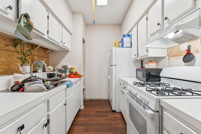 11303 Nicole Cv, Austin, TX 78753 - kitchen with white range with gas cooktop, under cabinet range hood, dark wood-style flooring, and light countertops