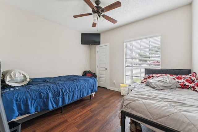 11303 Nicole Cv, Austin, TX 78753 - bedroom with wood finished floors, a ceiling fan, and a textured ceiling