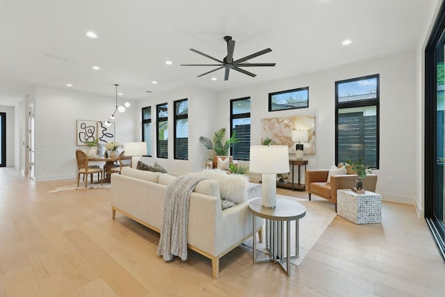 2711 Pegram, Austin, TX 78757 - living room with plenty of natural light, light wood finished floors, recessed lighting, and ceiling fan