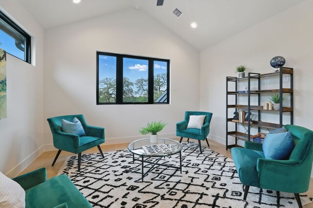 2711 Pegram, Austin, TX 78757 - living area featuring wood finished floors, lofted ceiling, and recessed lighting
