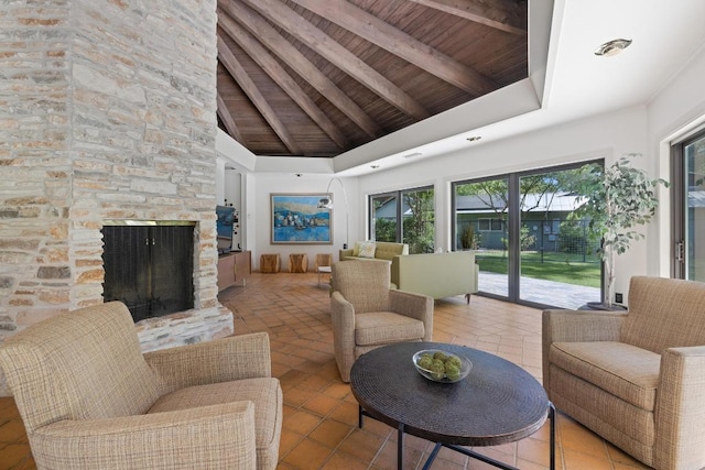 2401 Manana St, Austin, TX 78730 - living area with a wood ceiling with exposed beams, tile patterned floors, high vaulted ceiling, and a fireplace