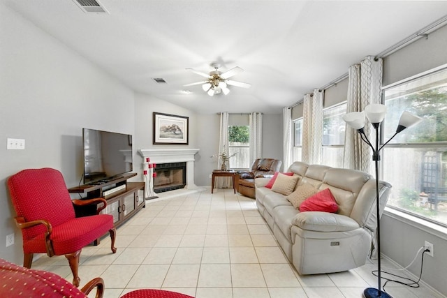 9602 Tea Rose Trl, Austin, TX 78748 - living area with healthy amount of natural light, a fireplace with raised hearth, and a ceiling fan