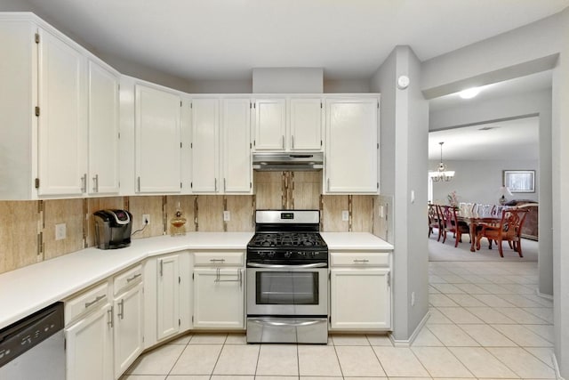 9602 Tea Rose Trl, Austin, TX 78748 - kitchen featuring stainless steel appliances, under cabinet range hood, a chandelier, and backsplash