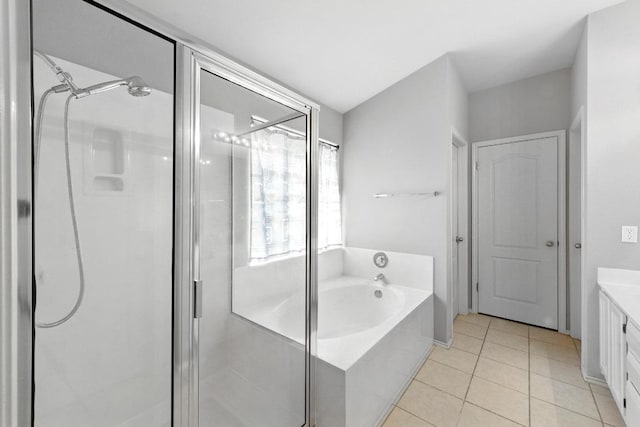 9602 Tea Rose Trl, Austin, TX 78748 - bathroom with a stall shower, a garden tub, vanity, and tile patterned floors