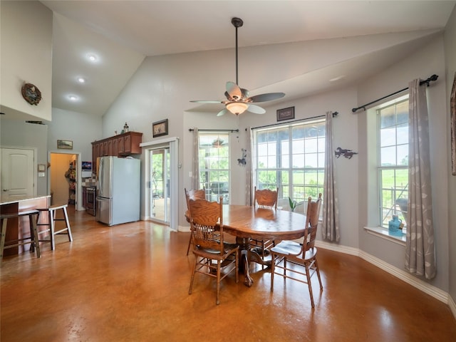 209 Old Sayers Rd, Elgin, TX 78621 - dining room with concrete floors, ceiling fan, and high vaulted ceiling