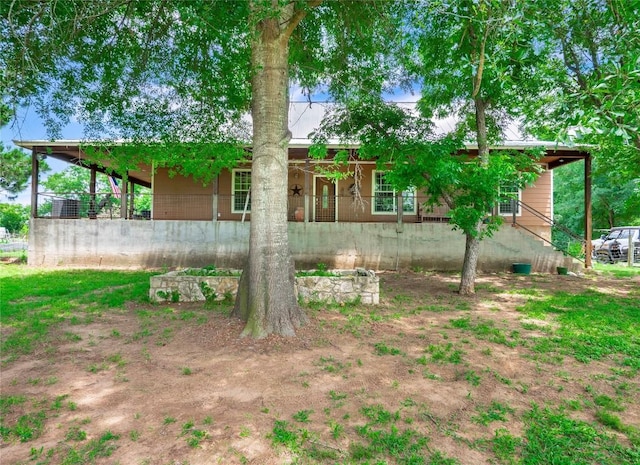 209 Old Sayers Rd, Elgin, TX 78621 - back of house with a metal roof