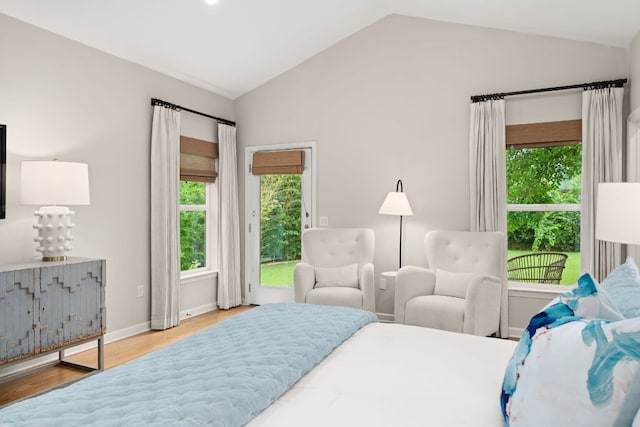 5212 Valley Oak Dr, Austin, TX 78731 - bedroom with lofted ceiling, multiple windows, wood finished floors, and access to outside