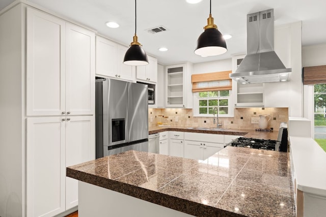 5212 Valley Oak Dr, Austin, TX 78731 - kitchen with tile counters, stainless steel refrigerator with ice dispenser, island exhaust hood, healthy amount of natural light, and recessed lighting