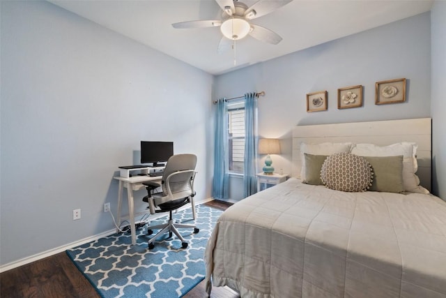 9204 Brents Elm Dr, Austin, TX 78744 - bedroom with wood finished floors, a ceiling fan, and an office area