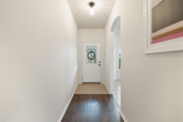 9204 Brents Elm Dr, Austin, TX 78744 - entryway with arched walkways and wood-type flooring