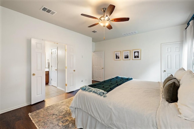 9204 Brents Elm Dr, Austin, TX 78744 - bedroom with wood finished floors and a ceiling fan