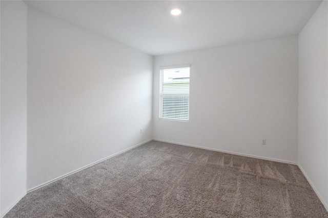 421 Bluejack Way, Hutto, TX 78634 - carpeted spare room featuring baseboards and recessed lighting