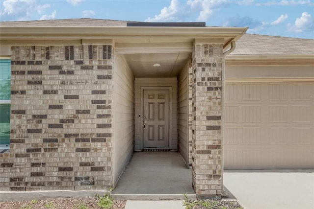 421 Bluejack Way, Hutto, TX 78634 - doorway to property with a shingled roof and a garage