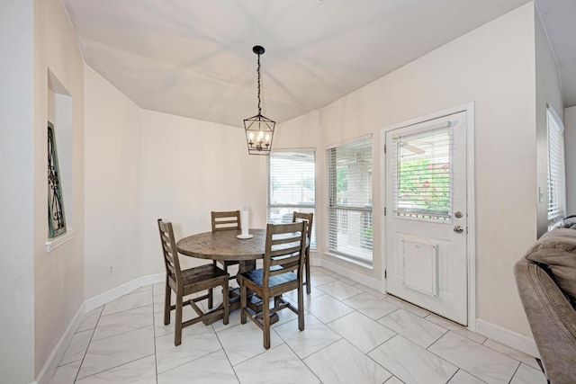 500 Olympic Dr, Pflugerville, TX 78660 - dining area with light marble finish floors and a chandelier