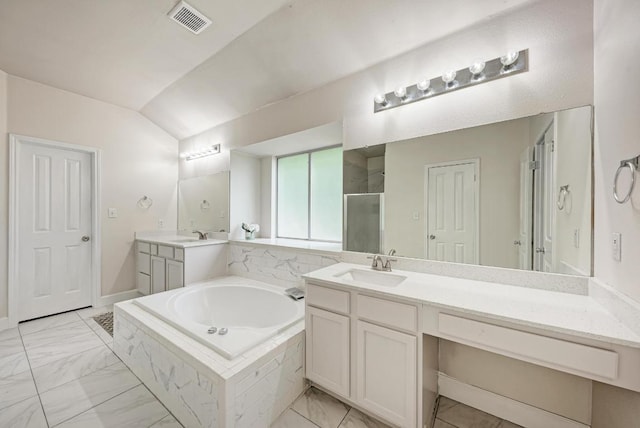 500 Olympic Dr, Pflugerville, TX 78660 - full bath featuring a bath, a stall shower, lofted ceiling, vanity, and marble finish flooring