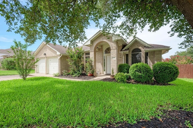 500 Olympic Dr, Pflugerville, TX 78660 - traditional home featuring brick siding, an attached garage, and concrete driveway