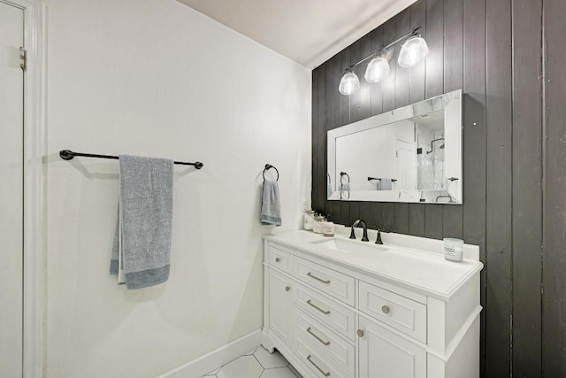 500 Olympic Dr, Pflugerville, TX 78660 - bathroom featuring vanity, wood walls, and tile patterned floors