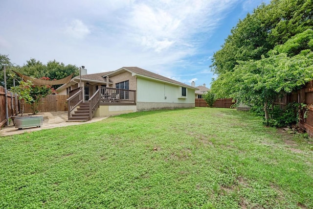 500 Olympic Dr, Pflugerville, TX 78660 - fenced backyard with a wooden deck, a patio, and stairs