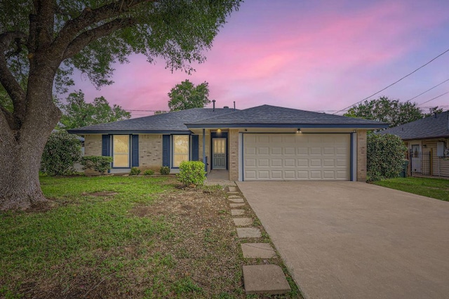 901 Garden Meadow Dr, Georgetown, TX 78628 - ranch-style house with driveway, an attached garage, a lawn, brick siding, and roof with shingles