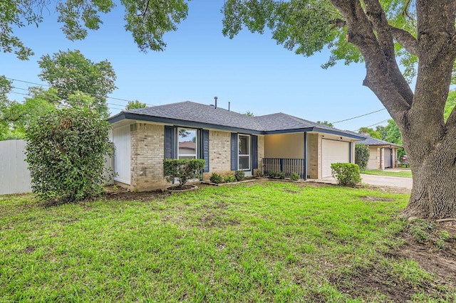 901 Garden Meadow Dr, Georgetown, TX 78628 - ranch-style house featuring a garage, driveway, a front yard, brick siding, and a shingled roof