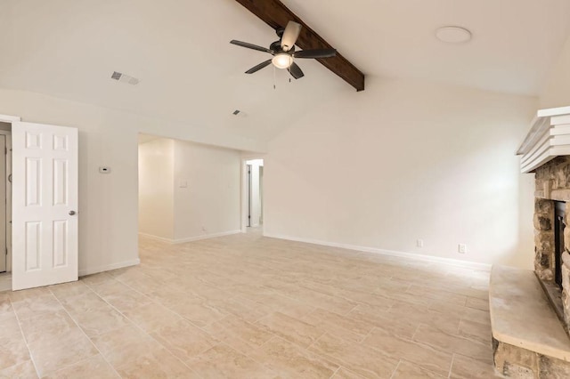 901 Garden Meadow Dr, Georgetown, TX 78628 - unfurnished living room featuring a ceiling fan, a stone fireplace, beam ceiling, and high vaulted ceiling