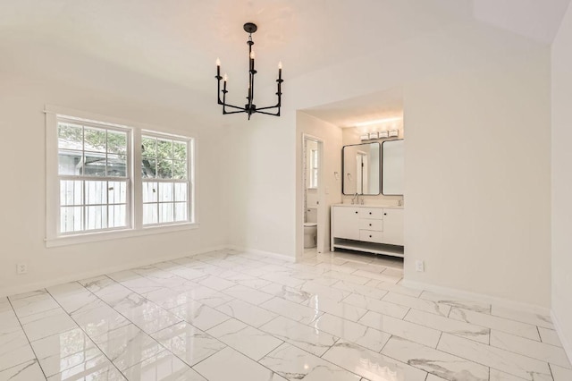 901 Garden Meadow Dr, Georgetown, TX 78628 - unfurnished dining area featuring a chandelier and marble finish flooring