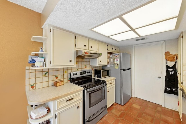 2500 Dana Cv, Austin, TX 78746 - kitchen with appliances with stainless steel finishes, open shelves, under cabinet range hood, decorative backsplash, and a textured ceiling