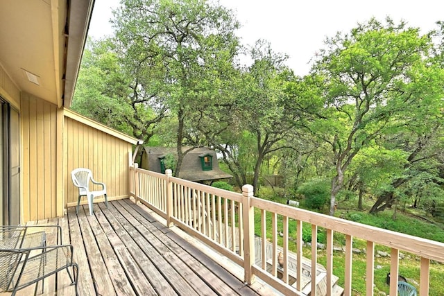 2500 Dana Cv, Austin, TX 78746 - wooden deck featuring view of wooded area