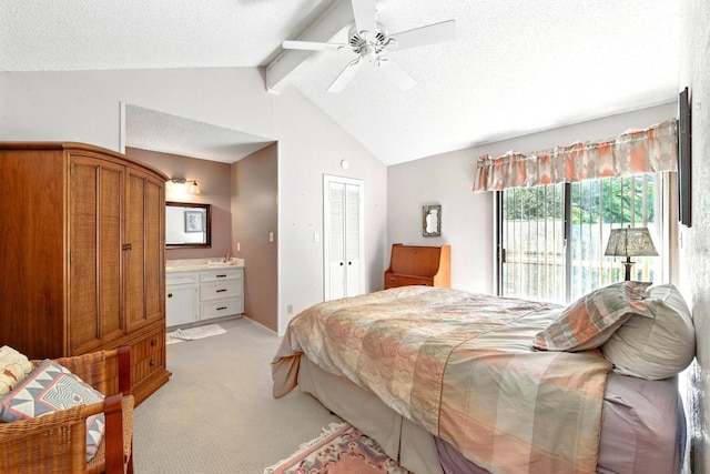 2500 Dana Cv, Austin, TX 78746 - bedroom with light carpet, ensuite bathroom, a closet, a ceiling fan, and a textured ceiling