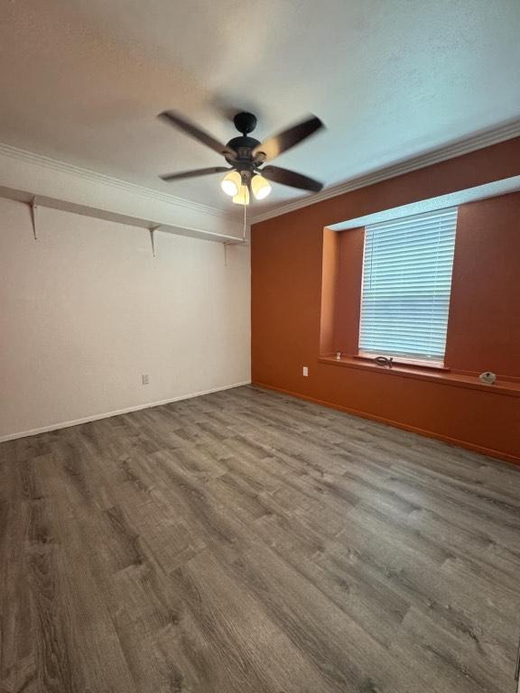 607 Garden Path Cv, Round Rock, TX 78664 - empty room featuring ornamental molding, a ceiling fan, and wood finished floors