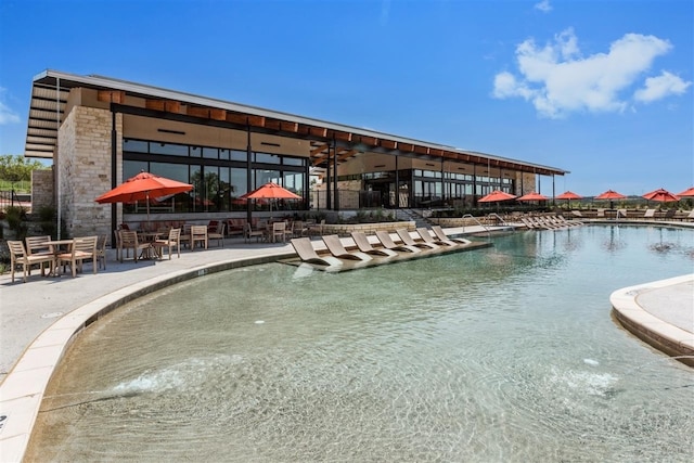 9900 Petrichor Blvd, Manor, TX 78653 - community pool with a patio