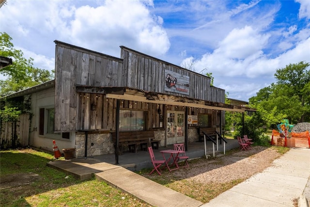 320 Creek Rd Unit 302, Dripping Springs, TX 78620 - back of house with french doors and stone siding