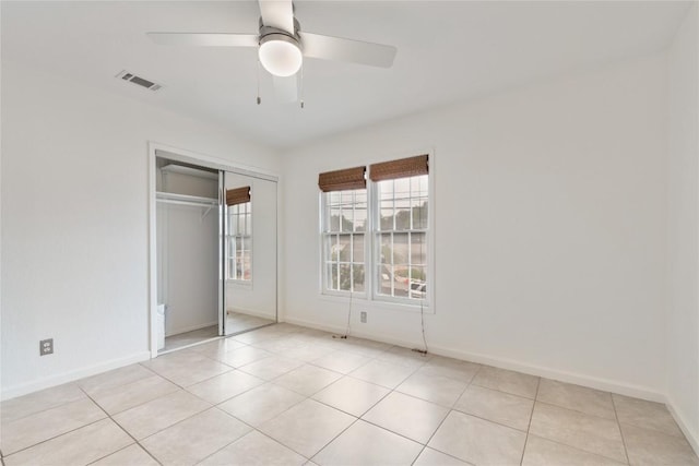 2122 Hancock Dr Unit 103, Austin, TX 78756 - unfurnished bedroom featuring a closet, light tile patterned floors, and ceiling fan