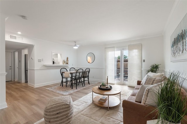 2122 Hancock Dr Unit 103, Austin, TX 78756 - living area featuring light wood-type flooring, a ceiling fan, and ornamental molding