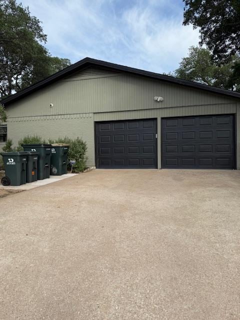 6203 Olympic Overlook Dr, Austin, TX 78746 - garage with concrete driveway
