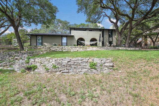 6203 Olympic Overlook Dr, Austin, TX 78746 - back of house with a lawn and stucco siding