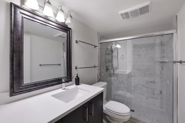 6203 Olympic Overlook Dr, Austin, TX 78746 - full bath with vanity and a stall shower