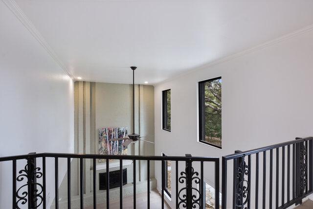 6203 Olympic Overlook Dr, Austin, TX 78746 - hall featuring an upstairs landing and crown molding