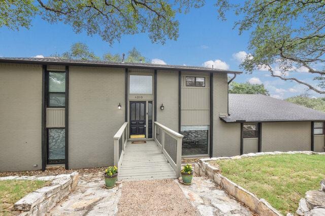 6203 Olympic Overlook Dr, Austin, TX 78746 - view of front facade with stucco siding