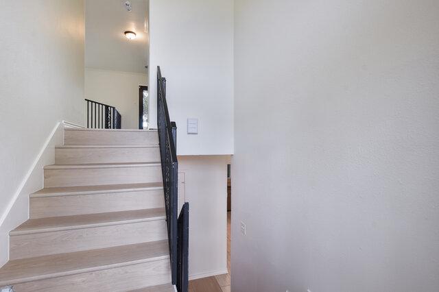 6203 Olympic Overlook Dr, Austin, TX 78746 - staircase with baseboards and wood finished floors