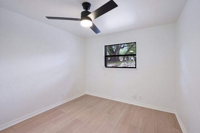 6203 Olympic Overlook Dr, Austin, TX 78746 - spare room featuring light wood-type flooring and a ceiling fan