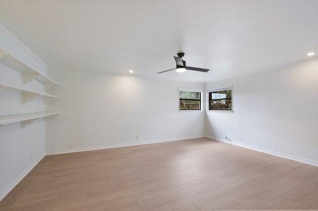 6203 Olympic Overlook Dr, Austin, TX 78746 - empty room with ceiling fan, light wood finished floors, and recessed lighting