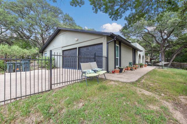 6203 Olympic Overlook Dr, Austin, TX 78746 - view of side of property featuring driveway