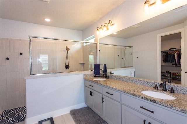 1328 Siena Sunset Rd, Leander, TX 78641 - bathroom with a walk in shower, double vanity, and a walk in closet
