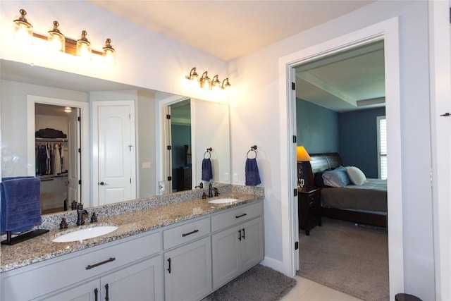 1328 Siena Sunset Rd, Leander, TX 78641 - full bath featuring double vanity, connected bathroom, and a walk in closet