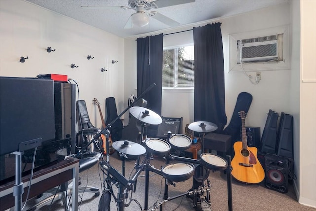 2721 Hemphill Park Unit B103, Austin, TX 78705 - game room featuring a wall mounted AC, carpet floors, a ceiling fan, and a textured ceiling