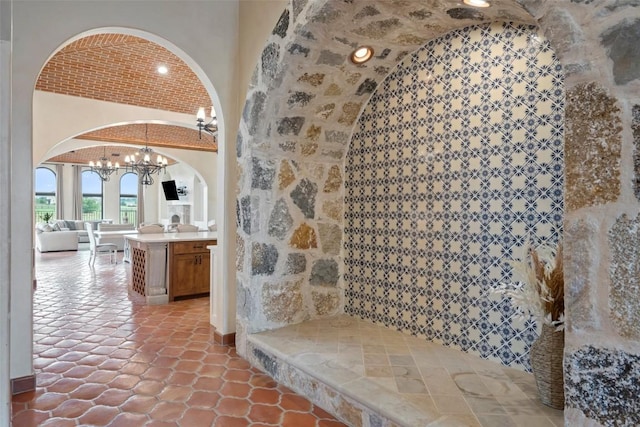 108 Country Vista Ln, Georgetown, TX 78626 - wine cellar featuring arched walkways and a chandelier