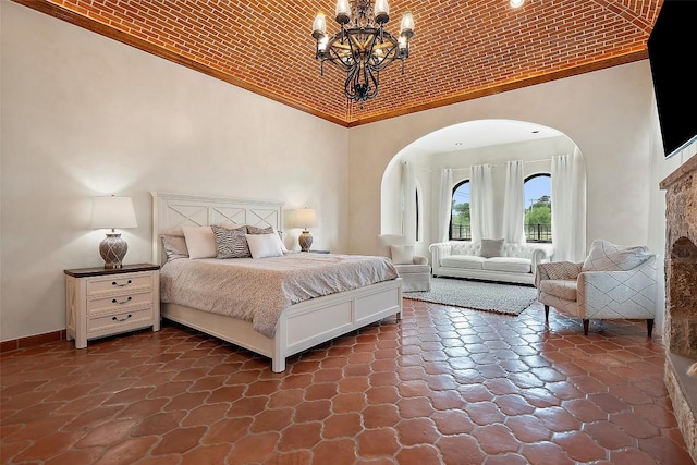 108 Country Vista Ln, Georgetown, TX 78626 - bedroom with high vaulted ceiling, arched walkways, and a chandelier